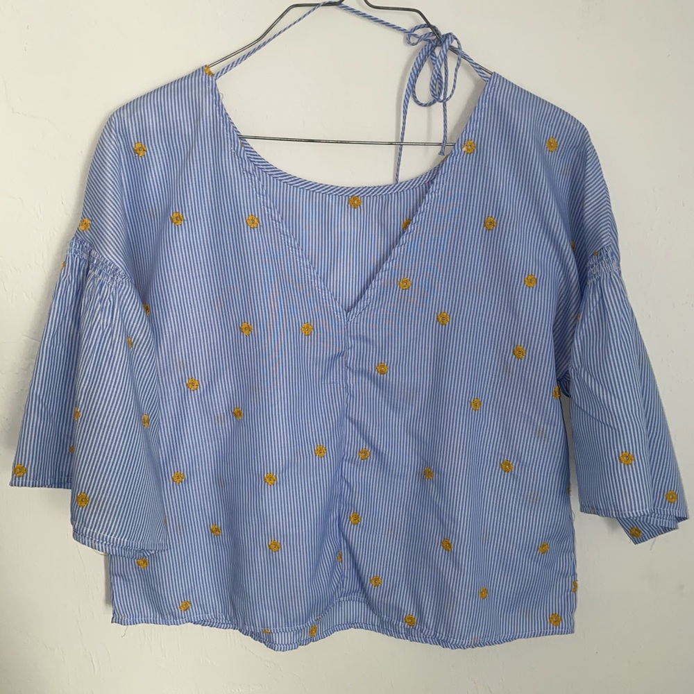 White and blue striped shirt with yellow flowers